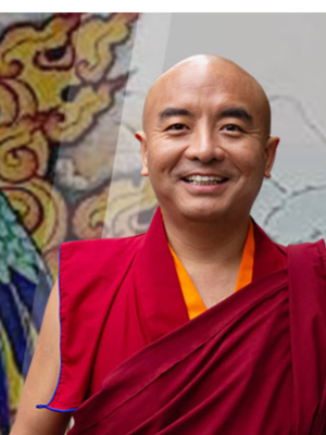 Yongey Mingyur Rinpoche blickt lachend in die Kamera